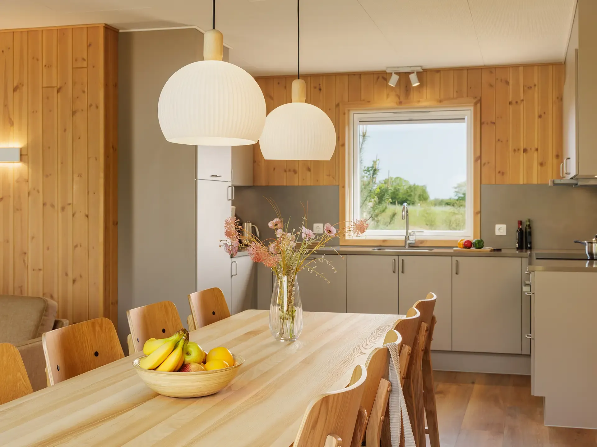 Contract-grade dining and kitchen furniture designed for long-stay resort accommodation at Nordborg Resort.