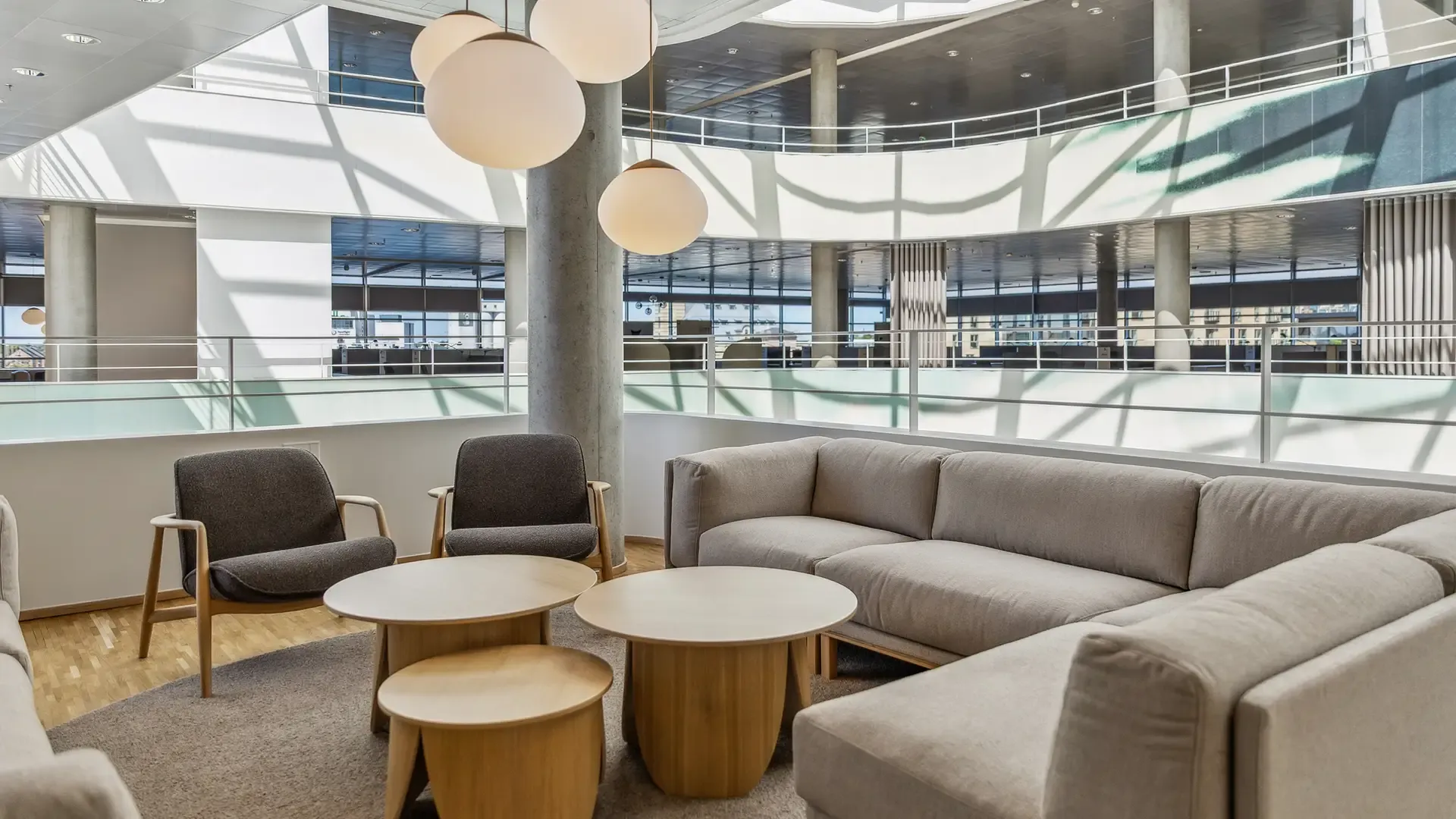 Flexible sofa lounge seating with coffee tables for modern office interiors and design solutions.