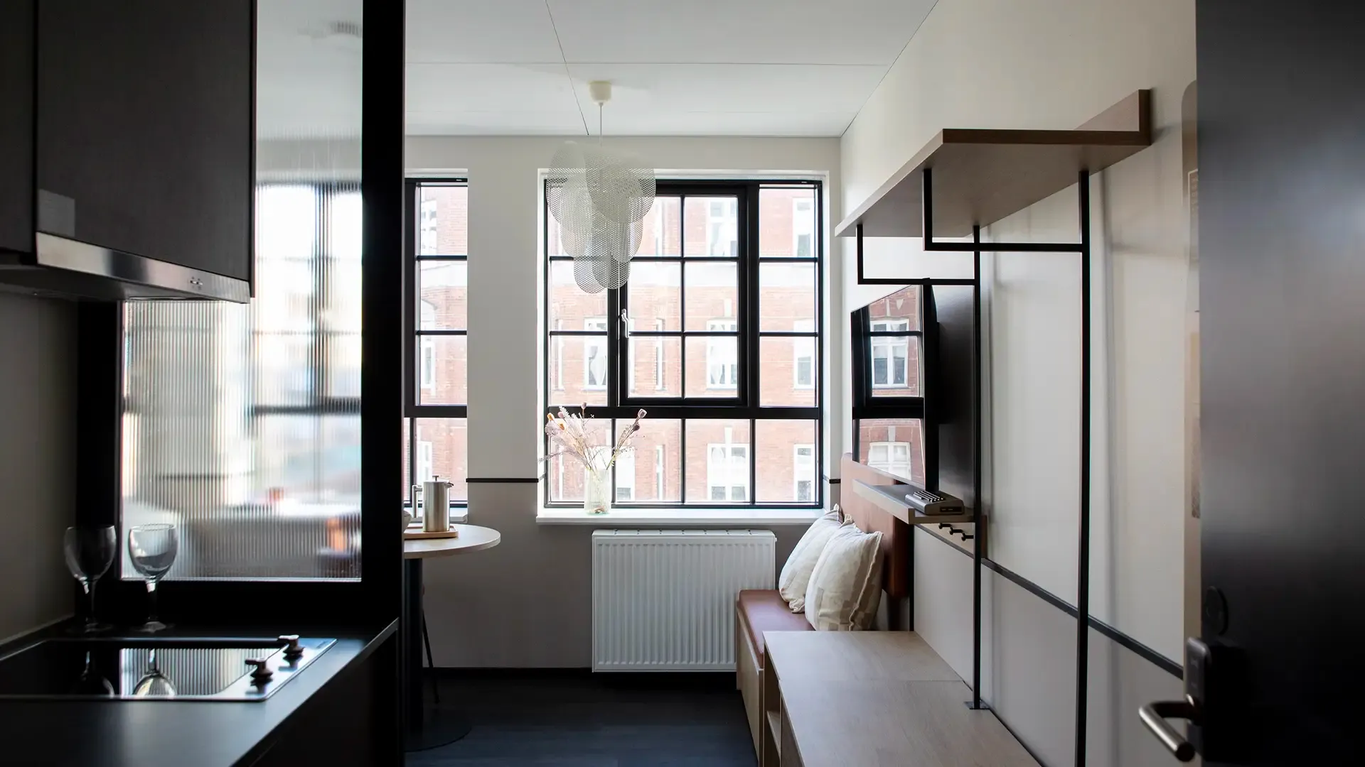Hotel apartment interior in modern Nordic style, combining bright, functional layouts with durable materials for long-term performance.